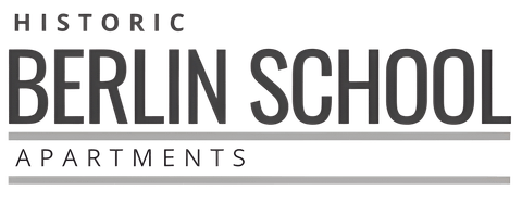 A sign for "Historic Berlin School Apartments" is displayed.